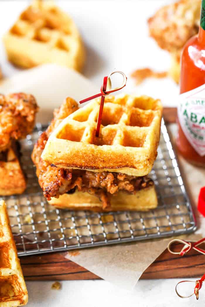 Chicken and waffle sliders ready to serve on a wire rack