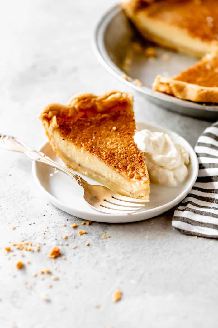 A close up of a slice of egg pie recipe on a white plate ready to eat