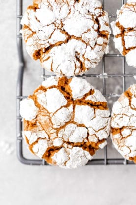 An overhead of ginger crinkle cookies on a wire rack