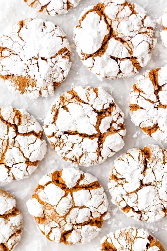Gingerbread cookies on a white background with powdered sugar on top