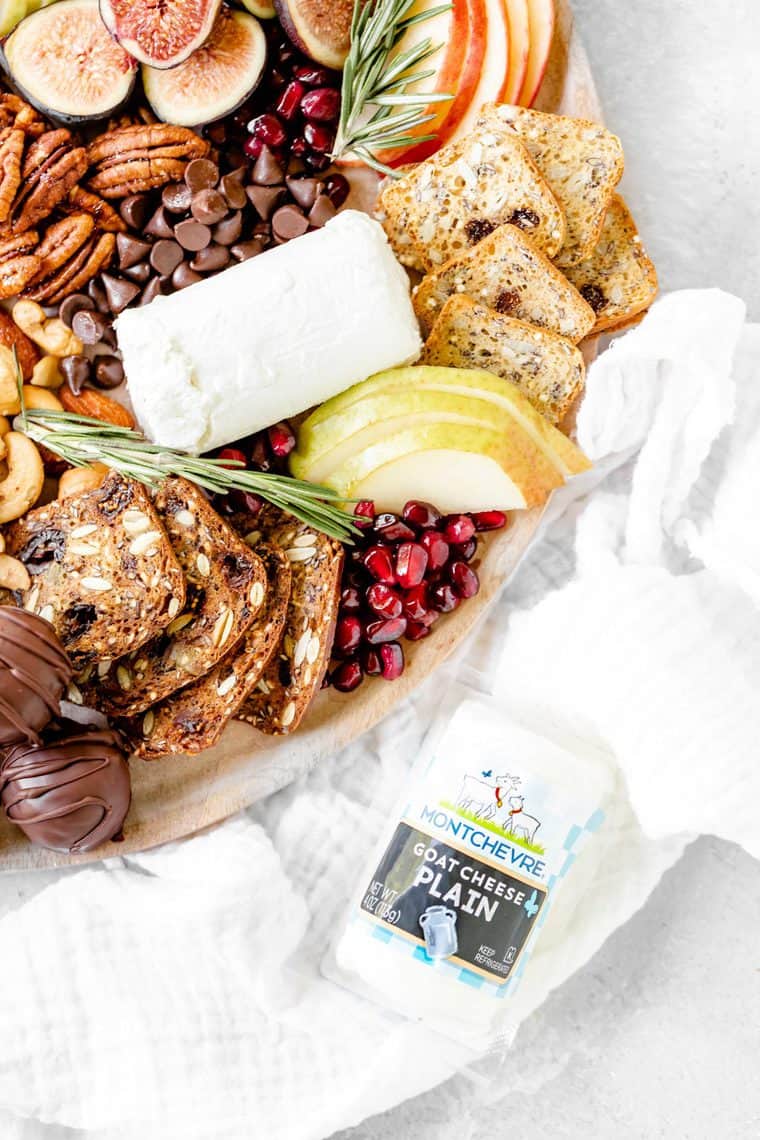 A close up of dessert board with goat cheese ready to serve for the holidays