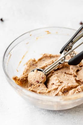 Goat cheese cream cheese filling being scooped