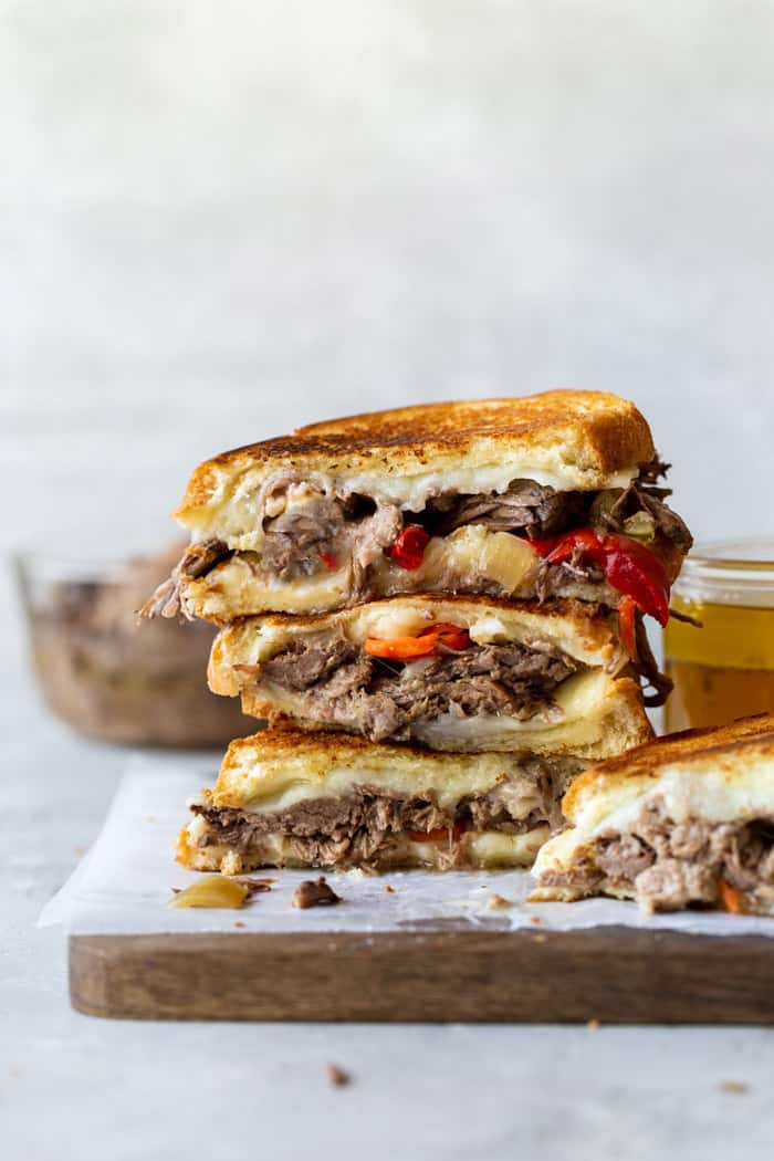 Stacks of Italian beef stuffed grilled cheese sandwiches ready to eat