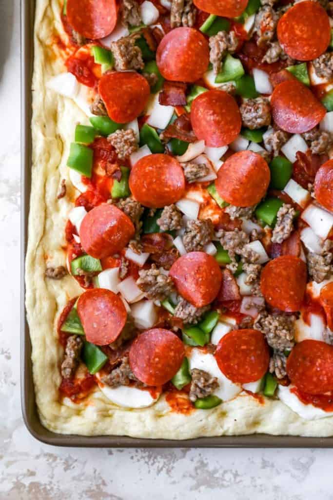 Dough with toppings ready to bake