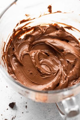 A delicious chocolate buttercream after being whipped inside a mixer bowl
