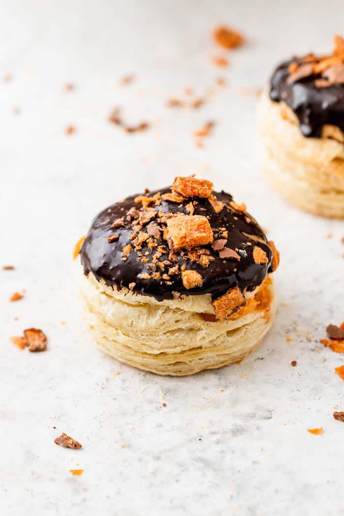 One pumpkin stuffed donut with a chocolate ganache topping ready to serve