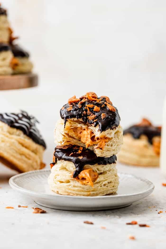 Two stuffed donuts with pumpkin cream filling with bites