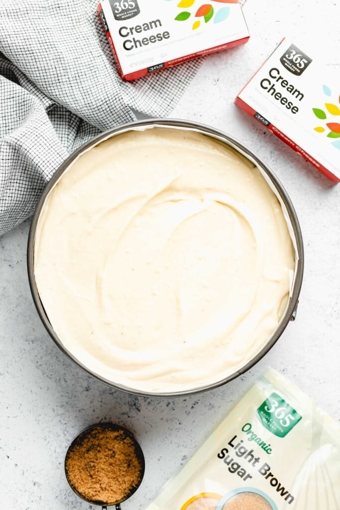 Cheesecake batter poured into springform pan before baking
