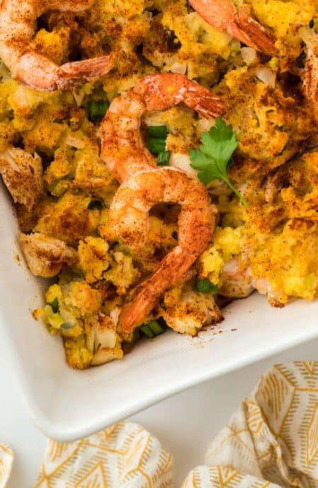 Close up view of seafood dressing in the baking dish