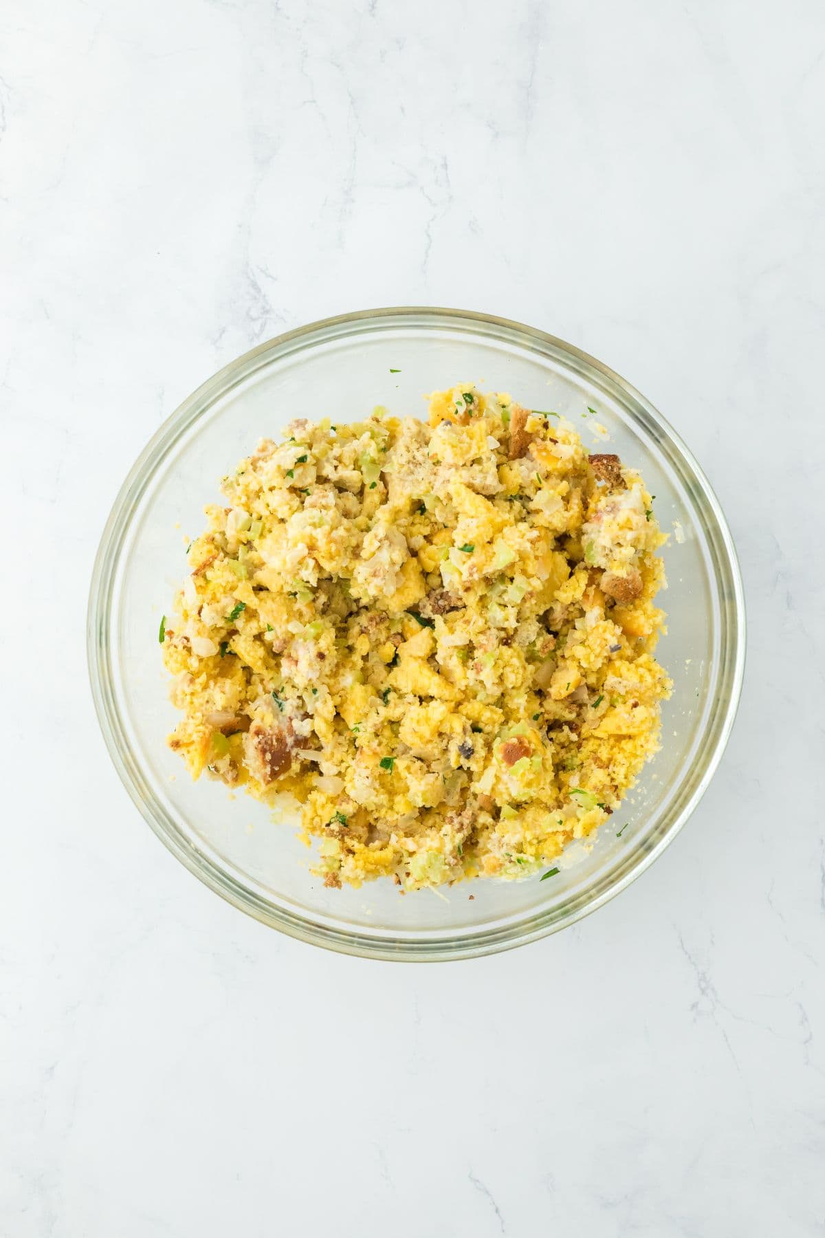 Fully mixed seafood dressing batter in a large glass bowl