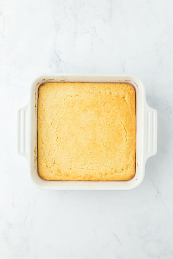 Golden-baked cornbread in a white rectangular dish