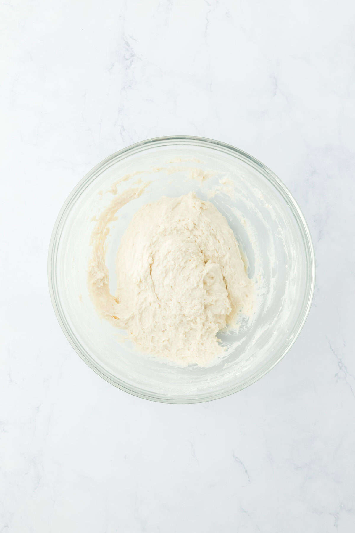 7 up biscuit dough in a glass bowl on white countertop