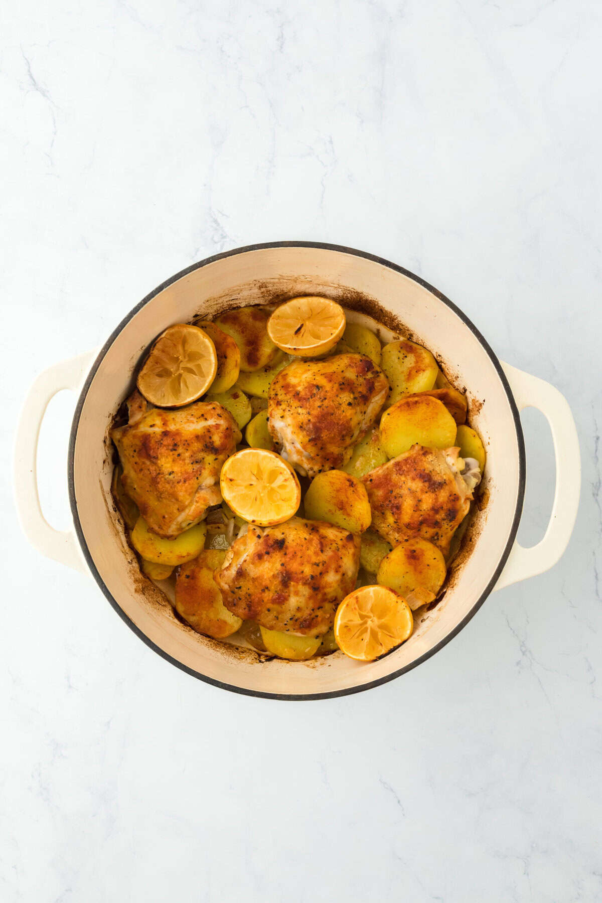 Roasted chicken in a dutch oven after baking ready to enjoy