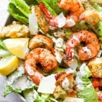 Creole shrimp on a bed of lettuce with caesar dressing