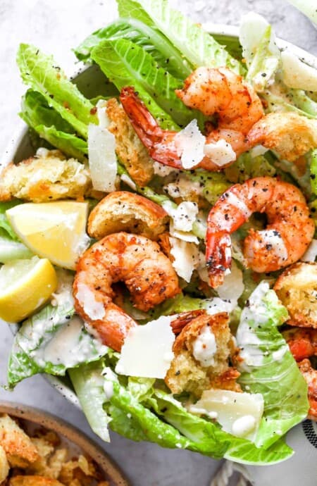 Creole shrimp on a bed of lettuce with caesar dressing