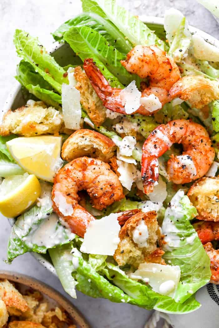 Creole shrimp on a bed of lettuce with caesar dressing