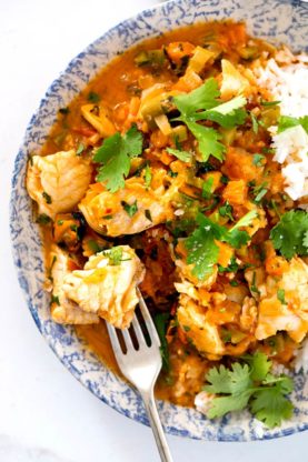 A close up of moqueca in a large bowl ready to eat