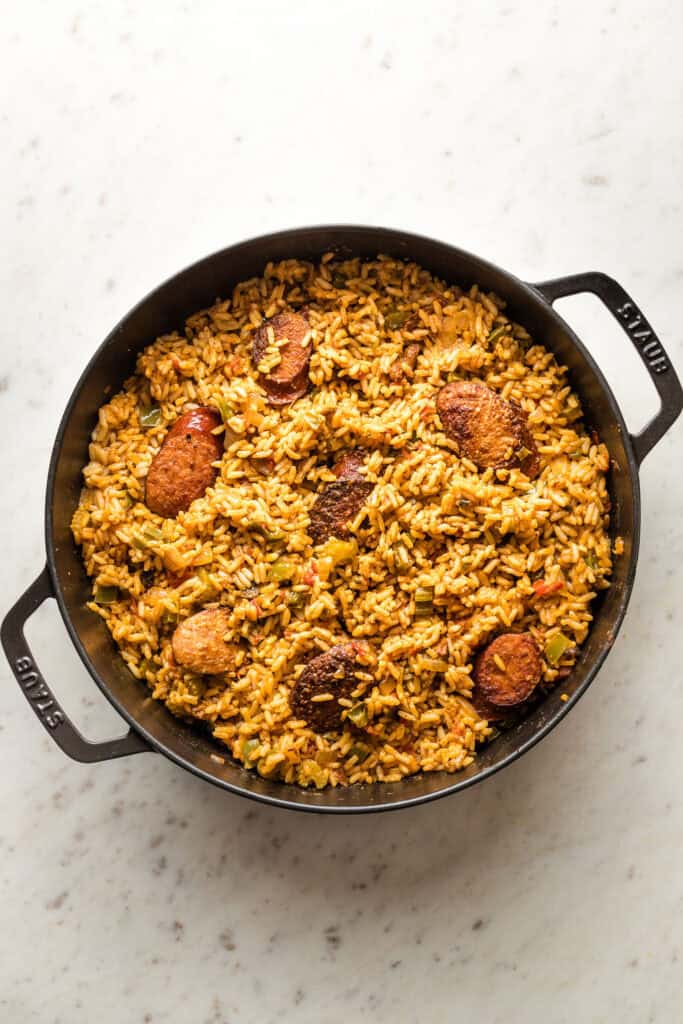 Rice and chicken stock added to skillet