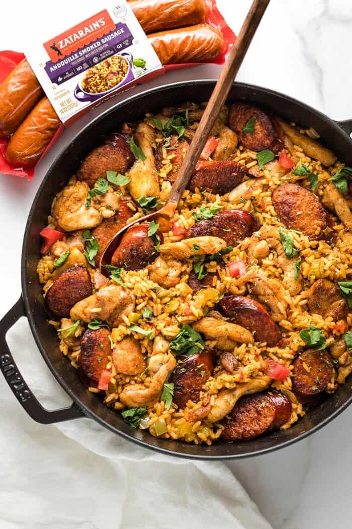 A delicious skillet filled with easy jambalaya with zatarain's sausage on top