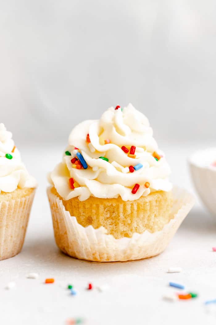 A cupcake with a liner beginning to come off