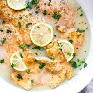 A delicious shot of chicken francese in a skillet before serving