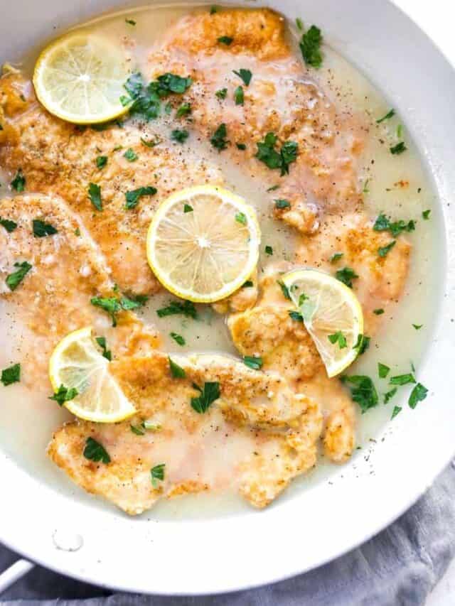 A delicious shot of chicken francese in a skillet before serving