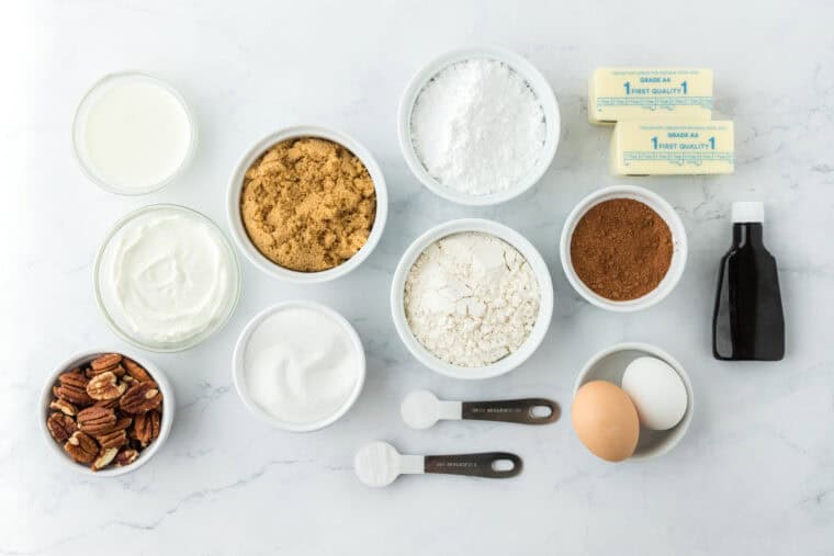 Ingredients in white bowls to make a chocolate texas sheet cake recipe
