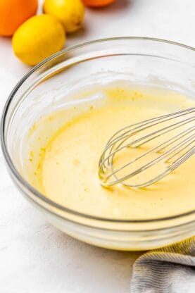 Citrus no bake pie filling with a whisk smoothing it out
