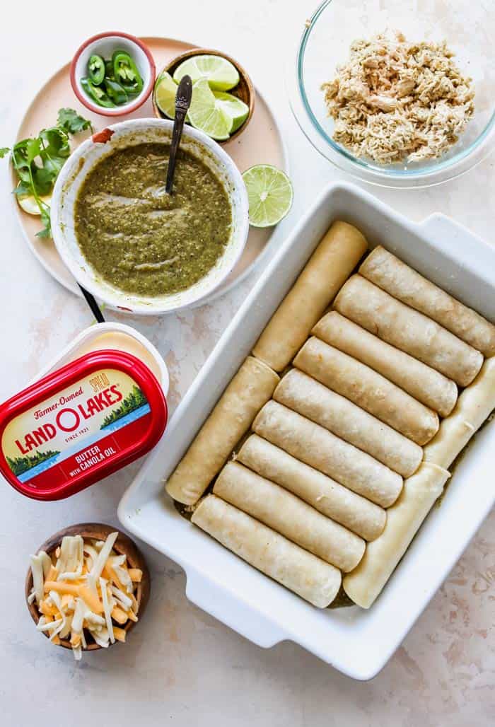 Ingredients with rolled tortillas with blackened chicken and salsa verde, butter and cheese on the side