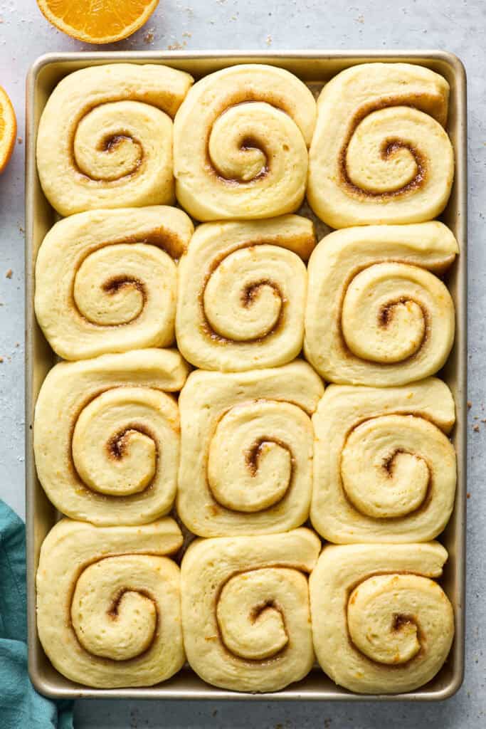 Orange cinnamon rolls after rising before baking