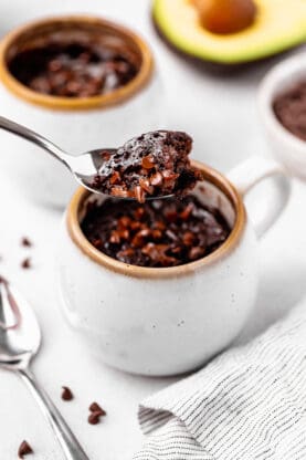 A delicious spoon full of mug brownie ready to enjoy