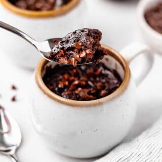 A delicious spoon full of mug brownie ready to enjoy