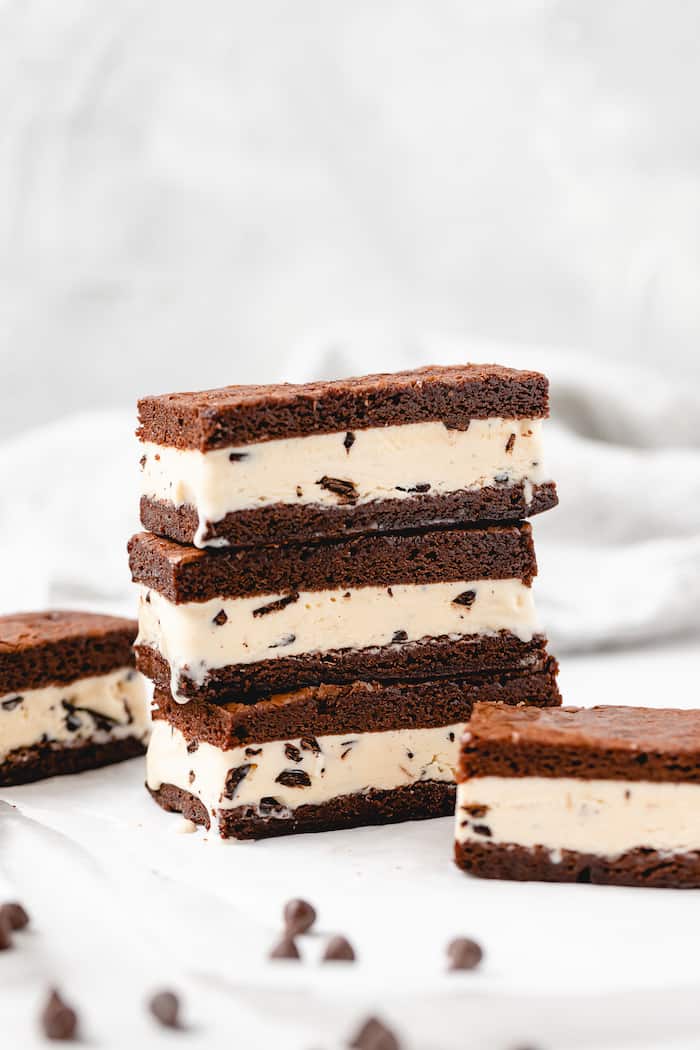 A stack of ice cream sandwiches on a white background ready to enjoy