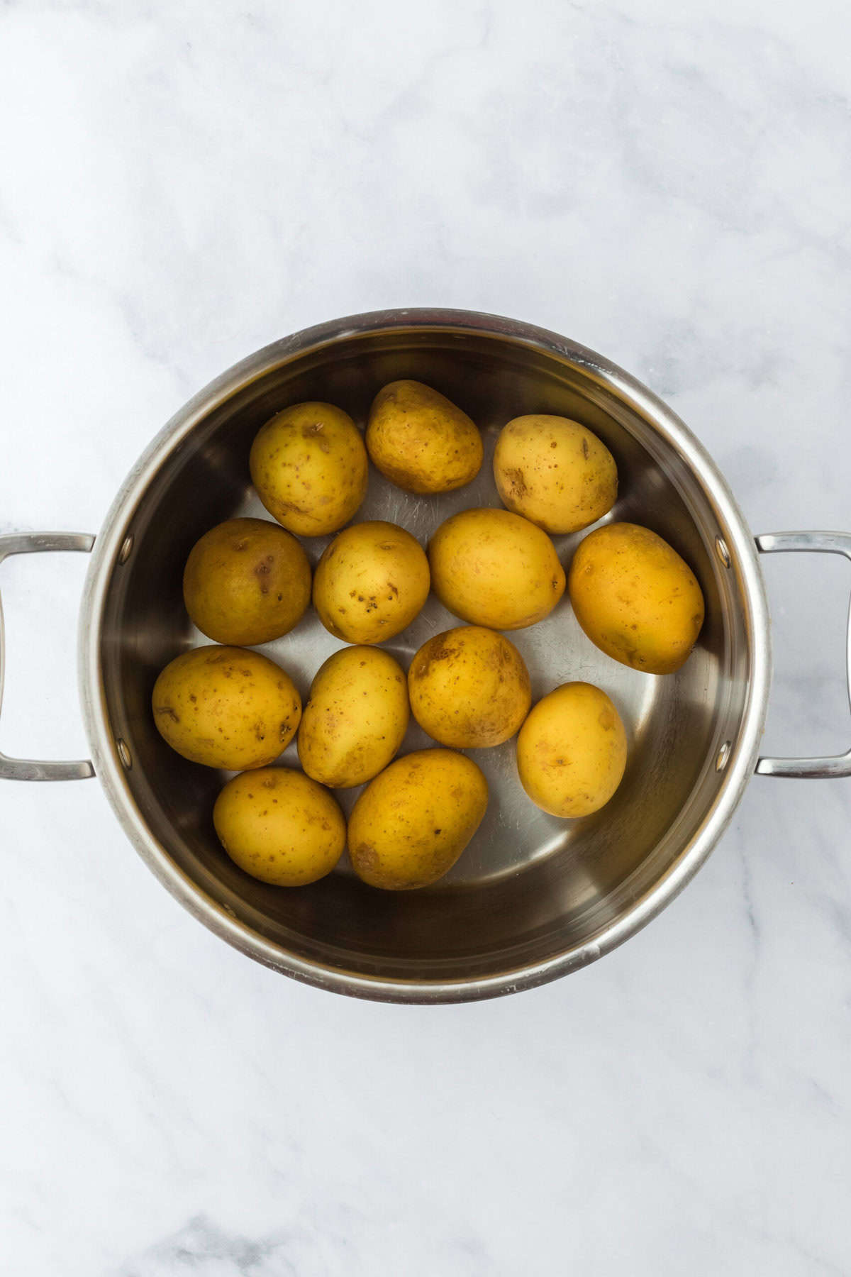 Yukon gold potatoes in a large pot before boiling