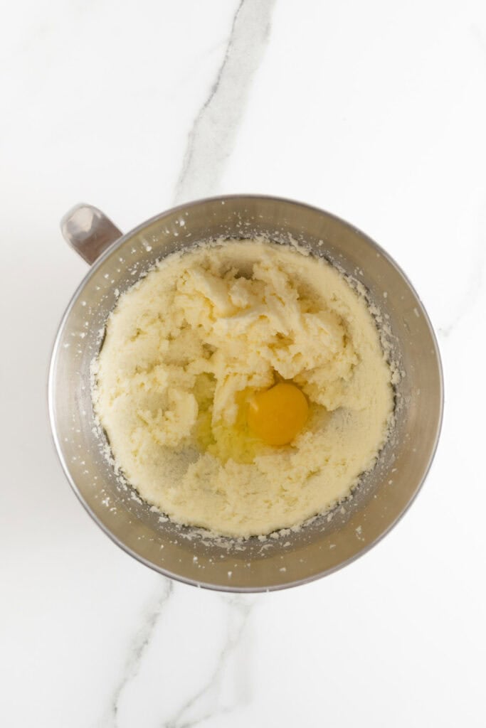 Egg added to creamed butter and sugar in stand mixer bowl