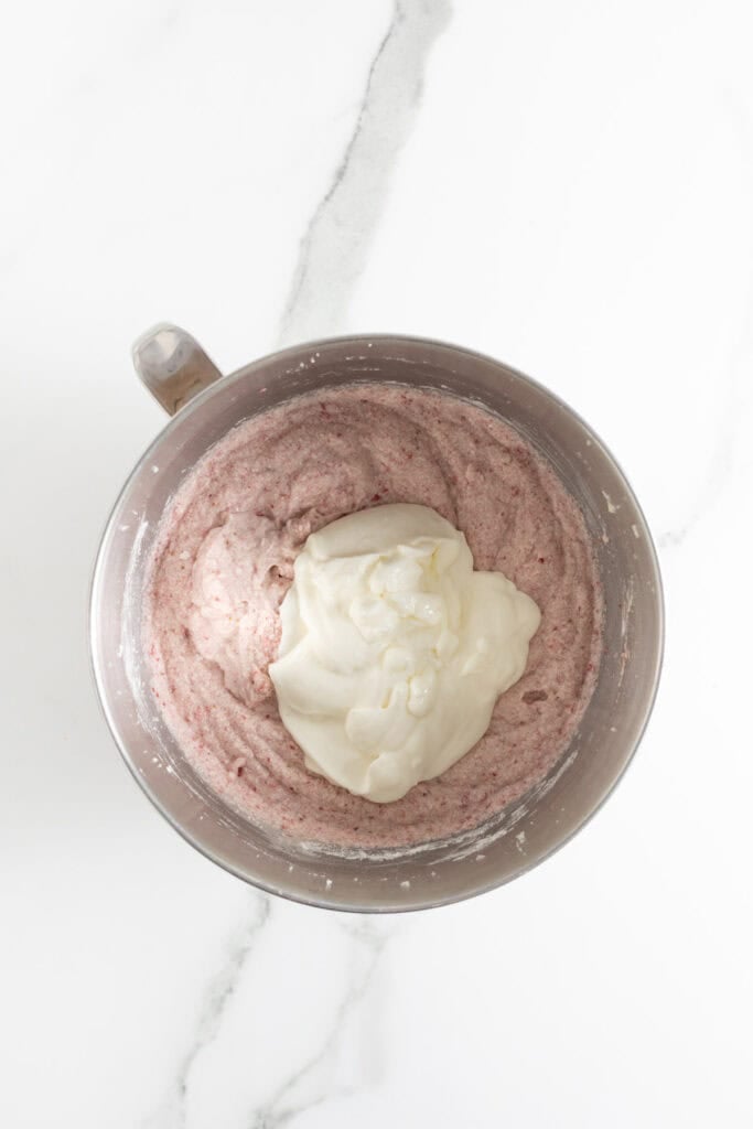 Wet ingredients being added to cake batter