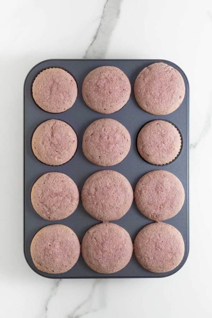 Baked strawberry cupcakes in a muffin tin