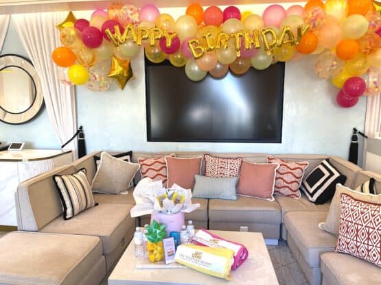 Happy Birthday balloons hanging in a pool cabana by The Venetian Las Vegas