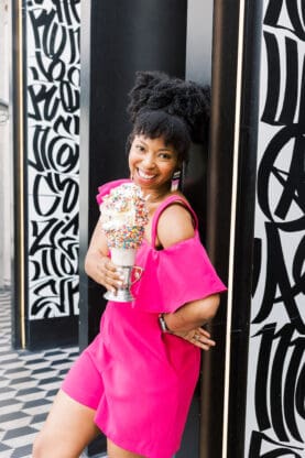 Jocelyn Delk Adams holding a cake shake at Black Tap Las Vegas at The Venetian