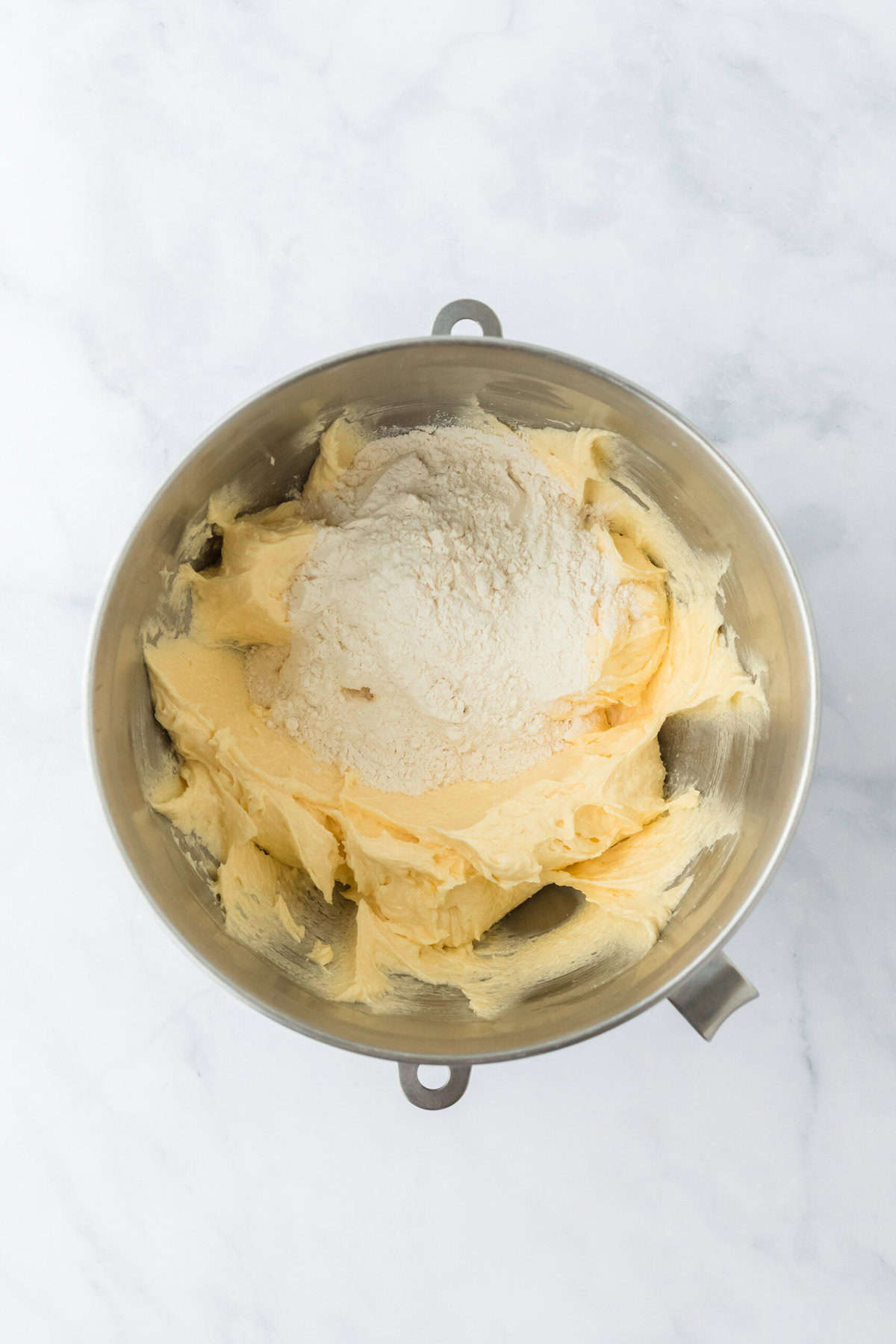 Dry ingredients added to stand mixer bowl to make easy banana cake batter