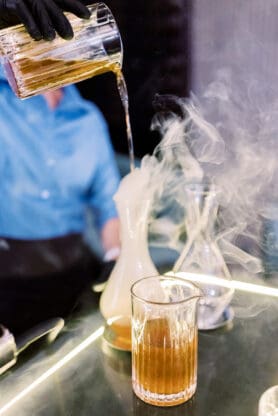 A smoked old fashioned being made by bartender in Las Vegas