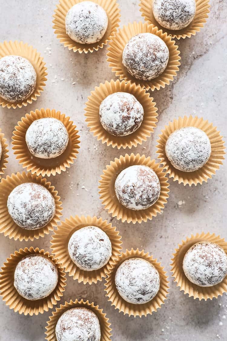 Kentucky bourbon balls in tiny containers in an overhead shot