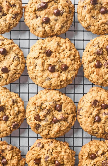 Baked chocolate chip oatmeal cookies on a wire rack