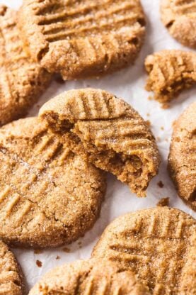 A close up of peanut butter cookies after being baked