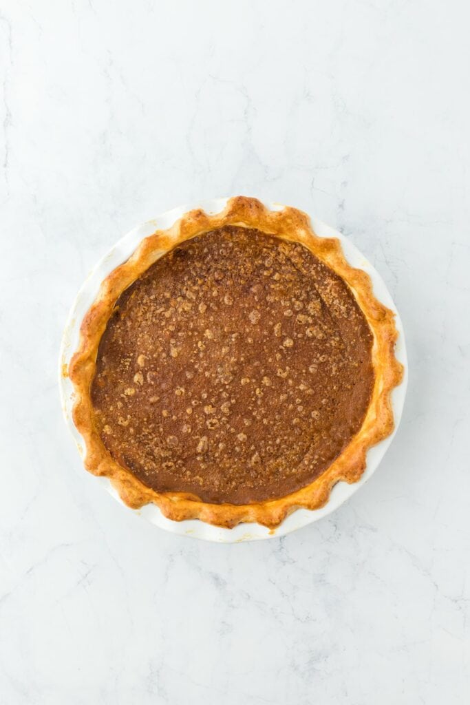 A completed pumpkin pie baked on a countertop
