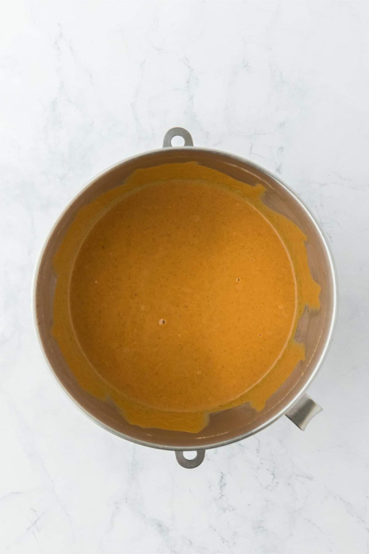 Overhead shot of a mixing bowl with fully mixed pumpkin pie filling