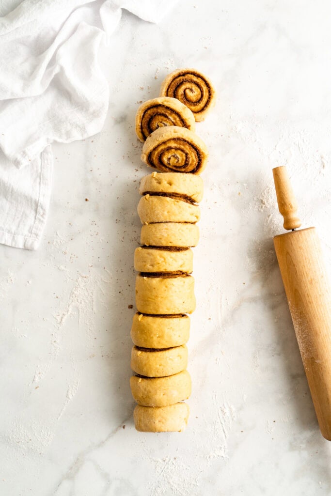 A cinnamon roll log cut into pieces