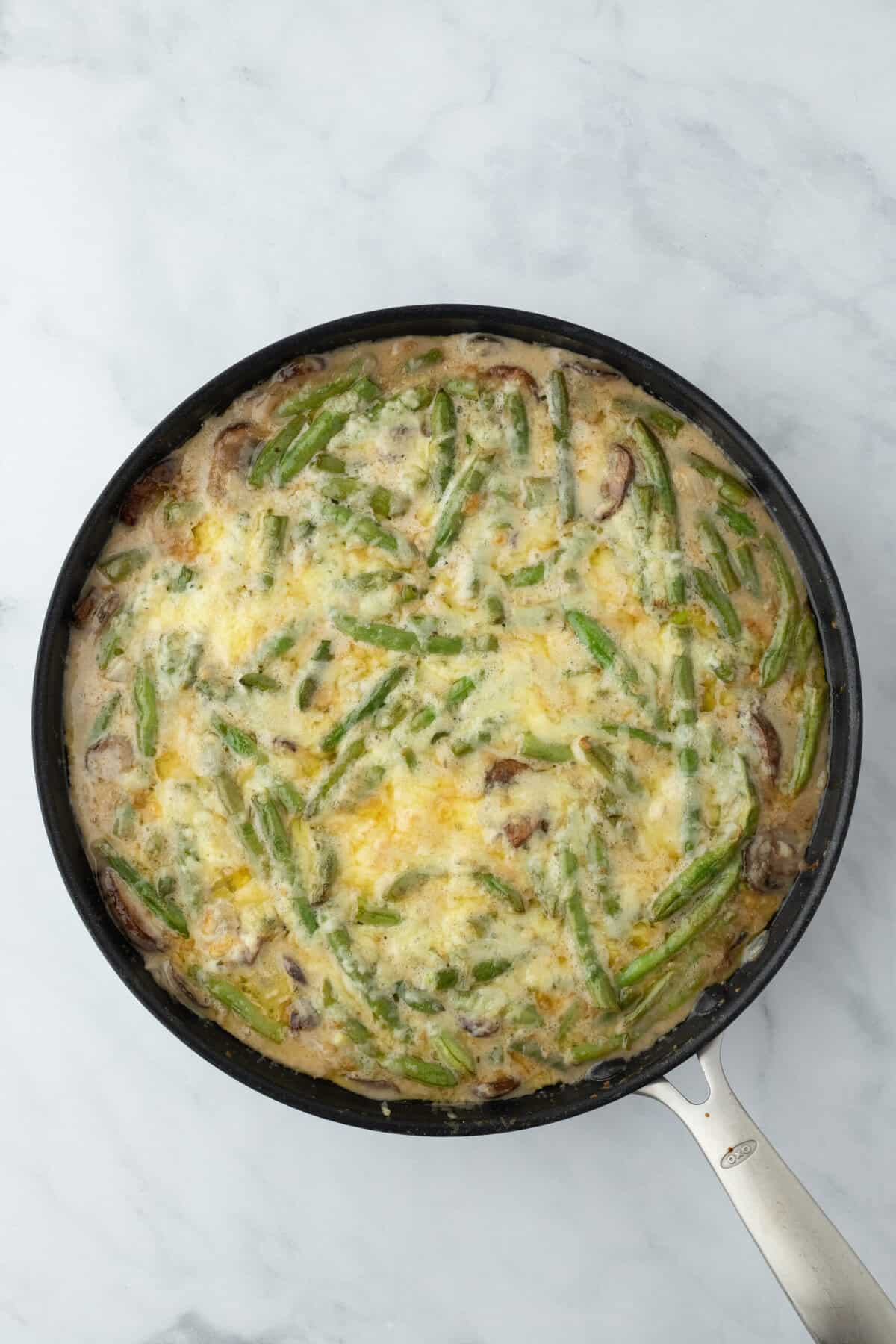 Cheesy green bean casserole after baking in oven for 20 minutes