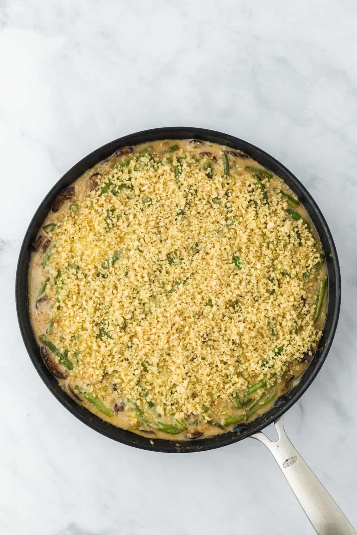 Garlic panko added to top of homemade bean casserole