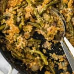 The best green bean casserole recipe with spoons digging in